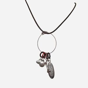 Dog bone charm necklace with red accents and black leather cord